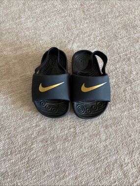 Nike Kids Black Slides with Gold Swoosh